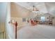 Large bonus room with vaulted ceilings, a ceiling fan, and built-in bookshelves at 95 Plymouth Ave, Charleston, SC 29412