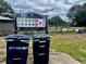 Food and compost drop off bins on a cloudy day at 95 Plymouth Ave, Charleston, SC 29412