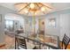 Dining space with a glass-top table, seating for four, and plenty of natural light coming through the windows at 95 Plymouth Ave, Charleston, SC 29412