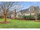 Well-maintained home with a lush green lawn, mature trees, and classic architectural details in a desirable area at 95 Plymouth Ave, Charleston, SC 29412