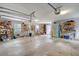 Spacious garage with ample storage shelving, overhead lighting, and clean epoxy floor at 95 Plymouth Ave, Charleston, SC 29412