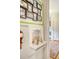 Hallway features built-in shelving and Gathering photos creating a warm and inviting space at 95 Plymouth Ave, Charleston, SC 29412