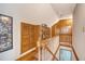 Upstairs hallway features hardwood floors, wood banister and built-in storage at 95 Plymouth Ave, Charleston, SC 29412