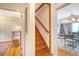 Hallway with wooden stairs leading to the next level, connecting various living spaces at 95 Plymouth Ave, Charleston, SC 29412