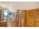 Second floor hallway with hardwood floors and built in shelving unit at 95 Plymouth Ave, Charleston, SC 29412