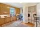 A tidy laundry room with built-in storage, a desk area, and a side-by-side washer and dryer at 95 Plymouth Ave, Charleston, SC 29412