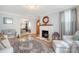 Inviting living room with a cozy fireplace, hardwood floors, and stylish furnishings at 95 Plymouth Ave, Charleston, SC 29412