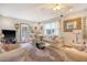 Bright living room with a comfortable sofa, ceiling fan, and view of the outdoor greenery at 95 Plymouth Ave, Charleston, SC 29412