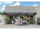 Exterior shot of the Charleston Flower Market storefront with a black and white awning at 95 Plymouth Ave, Charleston, SC 29412