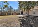 View of the backyard featuring a patio, shed, grassy area, and mature trees at 101 Danzid Dr, Summerville, SC 29483