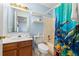 Bright bathroom with a vanity, toilet, and a shower/tub combination with a colorful curtain at 101 Danzid Dr, Summerville, SC 29483