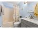 Cozy bathroom showcasing a vanity with storage, toilet, and a bathtub with a shower curtain at 101 Danzid Dr, Summerville, SC 29483