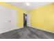Bedroom with a double-door closet, ceiling fan, and neutral carpet; doorway to another room is visible at 101 Danzid Dr, Summerville, SC 29483