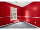 Bright bedroom featuring red walls, white trim, gray carpet and a window with blinds for natural light at 101 Danzid Dr, Summerville, SC 29483