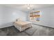 Light blue bedroom with a ceiling fan, two windows with shades, and carpeted flooring at 101 Danzid Dr, Summerville, SC 29483