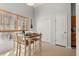 Dining area with a table set for four, bright window, and neutral decor at 101 Danzid Dr, Summerville, SC 29483