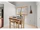 Charming dining area with natural light, table set for four, and bright white walls at 101 Danzid Dr, Summerville, SC 29483