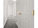 Neutral hallway with carpet and white doors leading to various rooms in the house at 101 Danzid Dr, Summerville, SC 29483