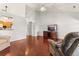 Inviting living room featuring hardwood floors, high ceilings, and a cozy recliner at 101 Danzid Dr, Summerville, SC 29483