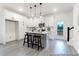 Modern kitchen with stainless steel appliances, white cabinets, gray flooring and an island with seating at 1020 Drakeford St # 9P, Saint George, SC 29477