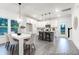 Open living space with dining area, kitchen with island, and lots of natural light at 1020 Drakeford St # 9P, Saint George, SC 29477
