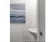 Compact powder room includes a modern sink and minimalist artwork at 1020 Drakeford St # 9P, Saint George, SC 29477