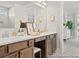 Bright bathroom features double vanity with white countertop, framed mirror and gray wood cabinets at 1022 House Finch Ave # Cc3-22-10P, Ravenel, SC 29470
