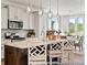 Modern kitchen with white cabinets, granite countertops, stainless steel appliances, and pendant lighting at 1022 House Finch Ave # Cc3-22-10P, Ravenel, SC 29470