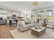 Bright living room and kitchen with ample seating and stainless steel appliances at 1022 House Finch Ave # Cc3-22-10P, Ravenel, SC 29470