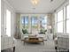 Bright living room with comfortable seating, large windows, and stylish decor at 1022 House Finch Ave # Cc3-22-10P, Ravenel, SC 29470