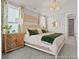 Elegant primary bedroom with coordinated decor, including green and beige tones at 1022 House Finch Ave # Cc3-22-10P, Ravenel, SC 29470