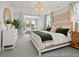 Serene primary bedroom suite with elegant furniture and a view to the connected sitting room at 1022 House Finch Ave # Cc3-22-10P, Ravenel, SC 29470