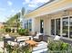 Relaxing outdoor patio featuring comfortable seating, elegant light fixtures, and beautiful backyard views at 1022 House Finch Ave # Cc3-22-10P, Ravenel, SC 29470