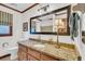 Bathroom featuring a granite countertop vanity with a decorative mirror and light fixture at 103 Night Hawk Ln, Summerville, SC 29485