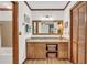 Bathroom featuring a vanity with granite countertops, decorative storage, and a large mirror at 103 Night Hawk Ln, Summerville, SC 29485