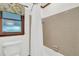 Bathroom displaying a shower/tub combination, window, toilet, and tile walls at 103 Night Hawk Ln, Summerville, SC 29485