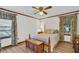 Bedroom featuring a bed with wooden trim, windows with curtains, and hardwood floors at 103 Night Hawk Ln, Summerville, SC 29485