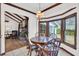 Cozy breakfast nook with wood table, chairs, and large windows overlooking the backyard at 103 Night Hawk Ln, Summerville, SC 29485