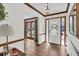Foyer showcasing hardwood floors, decorative trim, and a clear view into the adjacent living area at 103 Night Hawk Ln, Summerville, SC 29485