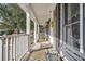 Long, covered front porch with seating, perfect for relaxing and enjoying the neighborhood views, all while enjoying a breeze at 103 Night Hawk Ln, Summerville, SC 29485