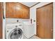 Laundry room featuring a washer, dryer, cabinets, and access door at 103 Night Hawk Ln, Summerville, SC 29485