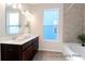 Well-lit bathroom with tiled shower and tub at 1044 Northern Flicker Dr # Cc3-18-2P, Ravenel, SC 29470
