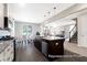 Open-concept kitchen featuring a large island, stainless steel appliances, and hardwood floors at 1044 Northern Flicker Dr # Cc3-18-2P, Ravenel, SC 29470