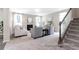 This carpeted living room is bright and features a cozy fireplace at 1044 Northern Flicker Dr # Cc3-18-2P, Ravenel, SC 29470