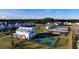 An aerial view showcases a modern community with pickleball courts, a pool, and well-maintained homes at 1045 Northern Flicker Dr # Cc3-19-5P, Ravenel, SC 29470