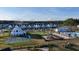 An aerial shot captures a vibrant community with a pool, playground, and charming homes near a forested area at 1045 Northern Flicker Dr # Cc3-19-5P, Ravenel, SC 29470