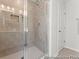 Bathroom showcasing tiled shower with glass door and ample space at 1047 House Finch Ave # Cc3-19-2P, Ravenel, SC 29470