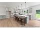 Spacious kitchen with grey cabinets, a large island with seating, and stainless steel appliances at 1047 House Finch Ave # Cc3-19-2P, Ravenel, SC 29470