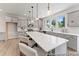 Open kitchen featuring a large island, gray cabinets, stainless steel appliances, and pendant lighting at 1047 House Finch Ave # Cc3-19-2P, Ravenel, SC 29470