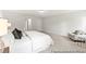 Comfortable main bedroom with sitting area, large bed and neutral tones at 1047 House Finch Ave # Cc3-19-2P, Ravenel, SC 29470